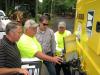 (L-R): John Edwards, Cowin Equipment Company; Jimmy Cole, Paulding County DOT; Andrew Bell, Cowin Equipment Company; and Michael Steele, Paulding County DOT, recalibrate the machine for a 1.5-in. cut.