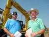 Shane Marquis (L) of Alabama Truck & Equipment, Tuscaloosa, Ala., and Dwight Swaim  of Tractor & Equipment Co., Decatur, Ala., swap some notes on excavators of interest.

