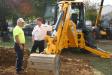 A JCB works on a pile of dirt at a previous event.