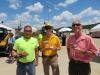 (L-R): John Ballmann, Ballmann Earthworks, and Matthew and Tom Kelpe of Kelpe Contracting Inc., enjoy the barbeque lunch at the anniversary celebration. 
