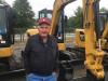 E.W Rust, owner of E Rust General Services in Delaware, checks out the Caterpillar mini-excavators