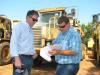 Cowin Equipment Company’s Andrew Bell (L) and Chad Rich, Ricky Rich Backhoe & Grading, Blairsville, Ga., search for bargains at the auction.  
