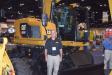Greg Bennett, government sales, Kelly Tractor, stands in front of this Cat M315F. 
