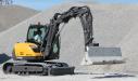 With the fork attachment, the Mecalac can easily place jersey barriers around the job site.