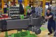 In the early phase of production, a model 12MTX begins its journey on the Mecalac assembly line.