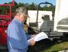 Eugene Nichols of Southland Equipment, Greer, S.C., studies up on a pair of Terex 6-ton site dumpers of interest.