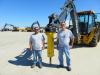 Ben Huffman (L) and Sergio Gonzalez, both of the city of south Milwaukee, check out this Atlas Copco EC 70 hammer.
