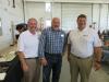 Barry Christian (C) of Payne & Dolan Contracting takes a tour of the shop area with Matt Sullivan (L), branch sales manager, and Scott Berlowski, both of Brooks Tractor.