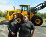 Former Ohio State Running Back Jordan Hall (L), who recently joined Company Wrench, welcome attendees to the JCB Rodeo event with Company Wrench’s Rob Barnett. 
