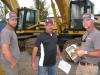 (L-R): Dawson Wood, Jared Bailey and Ken Wood, all of BW Grading Inc., Sugar Hill, Ga., hope to get a bargain on some Cat excavators.