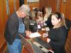 Heather Hall (L) and Tia Thomas, both of Martin & Martin Auctioneers, make quick work of registering bidders. 
