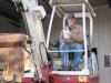 Jason Robinson of MAR Distribution Inc., based in nearby Bremen, Ga., studies the auction catalogue for details on a Takeuchi machine of interest. 
