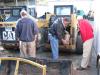 Local contractors carefully inspect a pair of Cat skid steer loaders before putting the machines on their bidding list.
