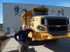 Bill Czerwinski, vice president of sales of Bell Trucks Western region, stands with this new Bell B60E.
