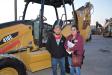 Oscar (L) and Araceli Perez traveled to Fort Worth from Houston to bid on backhoe loaders. The couple, who represent Garfia’s Auto Sales, are interested in this Cat 416E.
