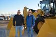 Manhattan, Kan., is best known as the home of Kansas State University, but it also is home to Midwest Concrete Materials Inc. Eric Lowery (L) and Broc Yakel represented the company at the auction and bid on this Cat 938M wheel loader.
