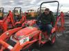 Some buyers like big equipment and some like small. On board a Kubota is Everett Kennedy of Barclay, Md.