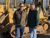 Joe Woods (L), The Ironpeddlers, Fountain Inn, S.C., and his father, Barry, look  over this Cat 939C crawler loader. 
