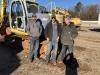 (L-R): Don Walls, Walls Rentals in Piedmont, S.C., and Justin and Bob Walker, both of Walker Land Clearing in Piedmont, S.C., inspect a Kobelco excavator. 
