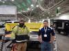 Dan Glennon, operations manager of Village Green, talks with Jay DeMars, Service One territory manager, about the features of this QP 114-in. SnowWolf plow.
