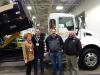 (L-R): Wendy Laughter, marketing, and Charlie Miller, sales manager, PLT, Little Canada, Minn., and Brian Galliva, results manager, and Paul Pinkalla, consulting arborist of PLT, take a look at this Rihm Kenworth with Beuroc 14-ft. contractor body.
