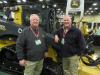 Mark Hash (L), Murphy Tractor & Equipment, talks with one of the dealership’s newest representatives, David Cooper, about the lineup of John Deere machines.
