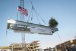 The beam is lifted during the topping out ceremony on Jan. 26 at the new College of Engineering building.
(Nora Lewis photo)