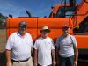 (L-R): Ernie Ballier of Meade Paper; Ron Gagne from Biddeford, Maine; and Ron Smith from Iowa took a strong look at this Doosan loader. 
