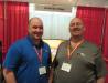 Steve McLachlan (L) and Andy Hildebrandt, both of Ditch Witch Sales of Michigan, welcome attandees to their booth.
