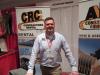 Adam Harding, AIS Construction Equipment/CRC Contractors Rental, stands ready to talk with attendees about the dealership’s lineup of equipment for sale and rent.
