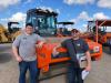 This Hamm compactor may find a new home with Sam Long (L) and Braden Herickhoff of AgTeck Drainage in Sauk Centre, Minn.
