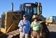 Jerry Hulgan (L) and John Case, both from Trenton, Ga., and both farm owners, are looking at this Caterpillar D6N and other equipment on the first day of the Ritchie Bros. auction. 
