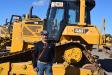 Sonny Miryala of Hansen Shipping, Toronto, Canada, inspects this Caterpillar D6N dozer during the first day of the Ritchie Bros. sale.