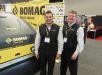 Bomag’s Sergio Solis (L) and Dave Dennison welcome customers and discuss the manufacturer’s road building equipment with attendees.
