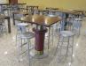 The employee cafeteria features custom built tables designed to resemble old machinery parts. 
