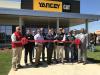 The official ribbon-cutting took place with Jim Stephenson, Yancey Bros. Co., chairman and CEO,  and Trey Googe, Yancey Bros. Co. president and COO, wielding the big scissors in the middle of this group and flanked by local dignitaries and key Yancey management members.
