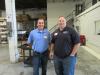 Tom Logan (L) and Derek Lemmons, both of NACD Inc., take a look around the shop.
