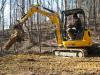 A McAlister Grading machine operator clears debris on a job site using a JCB 8035 ZTS.