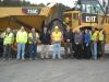 Key players from Schlouch and Foley pose in front of Schlouch’s new Cat 735C articulated truck at the company’s headquarters in Blandon, Pa. 