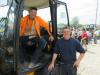 Carl Tanner (L) and John Galaida of S&S Commercial consider a bid on this JCB wheel loader.
