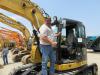 Rick Hohenbrink of Hohenbrink Excavating checks out this Caterpillar 314D LCR excavator while considering a bid. 
