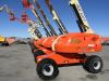 A lineup of JLG 400S boom lifts is ready to be put to work.
