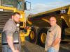Richard Keith McGuirt (L) and Chris Parris of New Generation Grading in Ball Ground, Ga., look over a water truck and some articulated trucks. 

