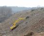 Workers finish clearing vegetation from an embankment along the southbound side of the Turnpike’s Northeastern Extension during an early stage of the Turnpike’s $225 million widening and improvement project in suburban Philadelphia.