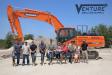 Venture has exclusive rights for the Doosan line in approximately an 80-mi. radius around Austin and handles the Epiroc line of hydraulic attachments for much of Texas. In photo, Venture family members include Michele McCarthy (6th from L), executive manager; Colt McCarthy (7th from L), president; Abigail McCarthy (8th from L); and Daphne McCarthy (9th from L).
