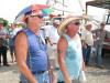 Auction attendees sporting some rather fashionable hats on a hot Alabama summer day are Levi Walls (L) of Walls Do-All, Summerville, Ala., and Todd Ellis, Northside Equipment Sales, Arab, Ala.