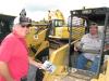 Sunny (L) and Eric Nail, NASCO LLC, Laurel, Miss., are interested in this ASV RC85 compact track loader.