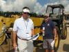 Interested in this Cat TH360B, are (L-R) Grant Dixon and Troy Mott, Providence Equipment, Dallas, Tex.