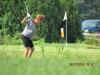 Golfer Peg Boddy makes her approach shot on to the green at the 10th annual Nortrax “Golf, Grub & Gravel.”