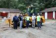 Crew members of Tom Buske Construction and J. Catanese & Sons rebuild the maintenance yard with Mark Signorelli, John Deere salesman of JESCO Equipment.